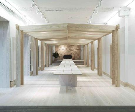 Dinesen showroom in Copenhagen with wood pergola and wood table
