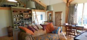 quirky accommodation with canopy and stars comfy-sofa-in-the-arc-cabin-cambridgeshire_cs_gallery_preview