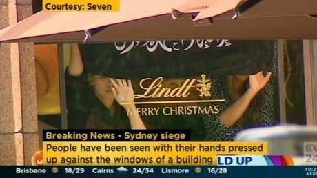 A screengrab apparently showing a jihadi flag being flown inside the Lindt Chocolat Cafe.