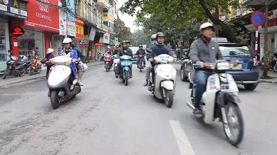 Crossing the street in Hanoi, Vietnam