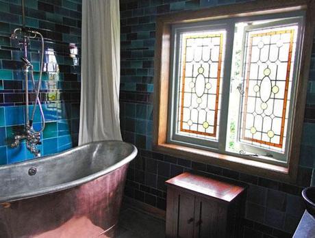 Colorful Bathroom with Stained Glass Window and Freestanding Tub