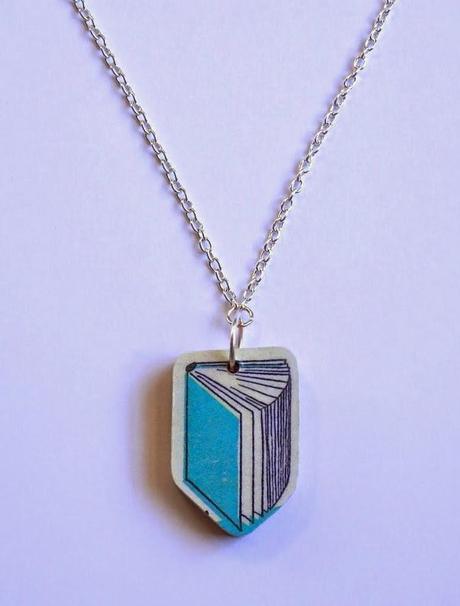 http://store.bookriot.com/collections/jewelry/products/wooden-book-necklace