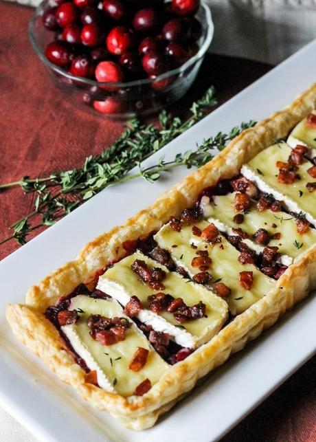 This Cranberry Brie Tart with Pancetta & Thyme is a unique appetizer that's perfect for the holidays! It's a delicious twist on a traditional baked brie.