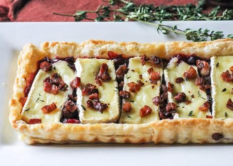 This Cranberry Brie Tart with Pancetta & Thyme is a unique appetizer that's perfect for the holidays! It's a delicious twist on a traditional baked brie.