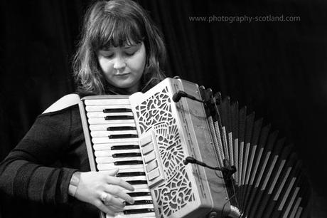 Event photo  (black and white)  - Mairearad green, accordionist with the Poozies