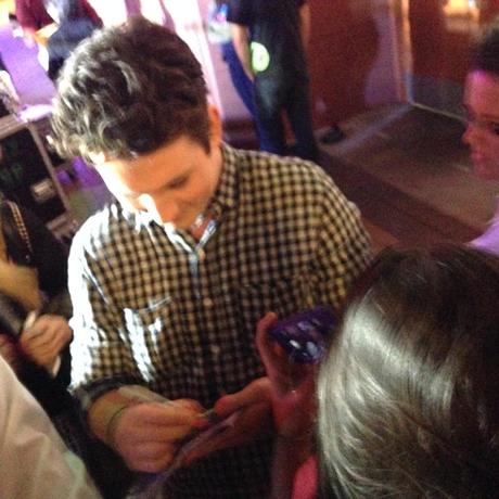 Miles signing the magazine! He was very nice to all of the fans.