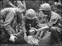 U.S. soldier in Vietnam supervises the waterboarding of a captured North Vietnamese soldier.