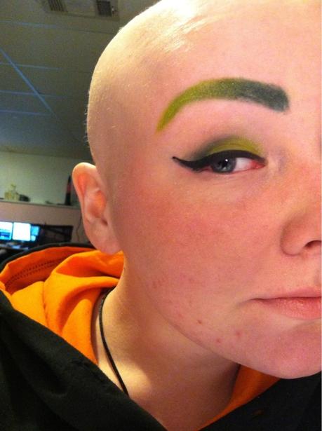 Probably the newest trend to embellish your brows. The lady has also kept the matching tradition on and matched her eye shadow completely with her brows.