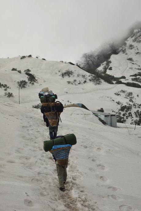 These Nepal porters would run up the steep hills, even in the snow, wearing nothing more than flip flops. They were in amazing shape to say the least!