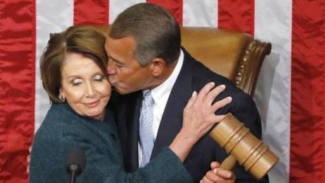 U.S. House Speaker John Boehner kisses House Minority Leader Nancy Pelosi, as he holds the gavel after being re-elected speaker on the House floor at the U.S. Capitol in Washington