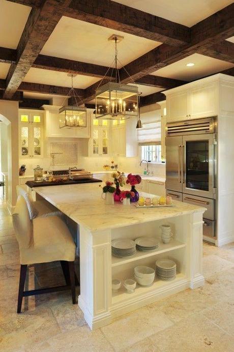 I absolutely LOVE this kitchen! Gorgeous beams, beautiful white cabinets and marble counter tops, flooring... everything! :)