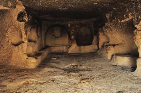 Inside one of the caves. Most of the rooms have shelves or cubbies in the wall.