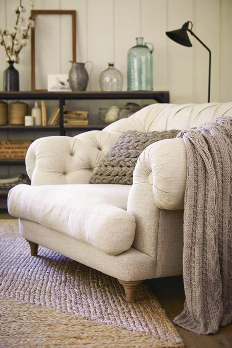Curl up in an oversized armchair with luxurious, deep button detailing. Photography: Mark Scott