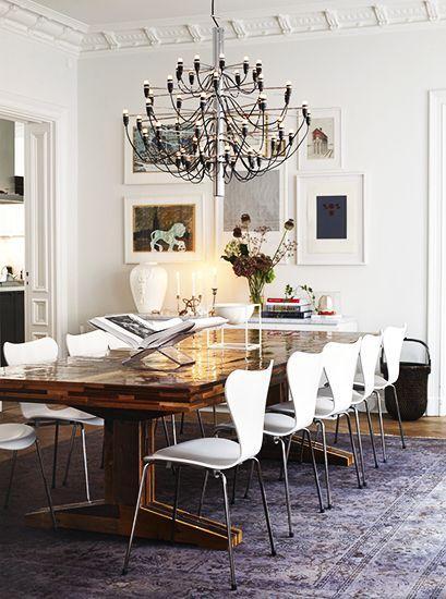 Tour the Most Beautiful Townhouses with Modern, Eclectic Style// modern dining chairs, crown molding, Gino Sarfatti chandelier
