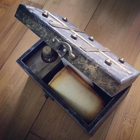 An antique looking box with the clue