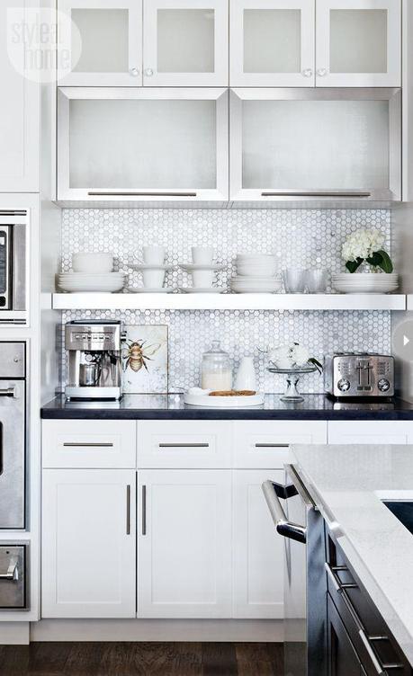 Such a cute kitchen and a great way to run stock cabinets to the ceiling and a shelf under rather than hanging them with that cheap, awkward empty space above!