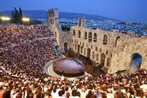 People inside the Odeon of Herodes Atticus waiting for theatrical ...