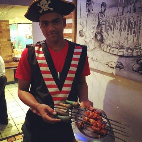 Waiters sportively posed for photographs in their pirate garb