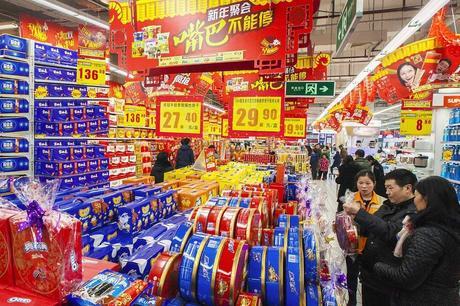 Customers select goods at a supermarket in Lianyungang, Jiangsu province. China's consumer price inflation slowed to a five-year low in January. 