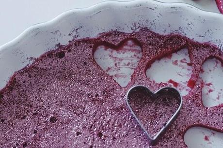 homemade raspberry yogurt gummy glitter hearts.