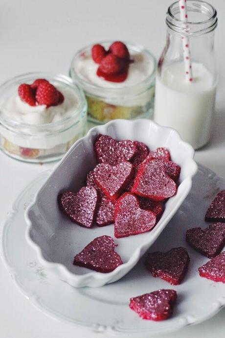 homemade raspberry yogurt gummy glitter hearts.