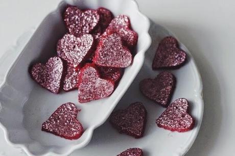 homemade raspberry yogurt gummy glitter hearts.