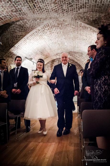 bride with father walking down aisle