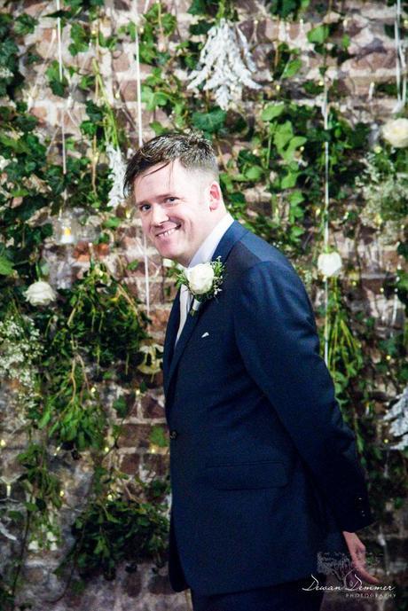 Groom sees bride walking down the aisle