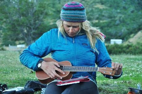 Emily playing the ukulele which she carries on the back of her bike!