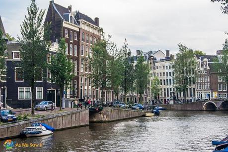 crooked houses along a canal in Amterdam