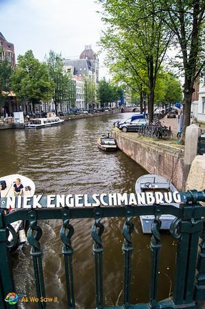 view of canal from atop Niek Engelschmanbrug, a bridge with an old iron railing