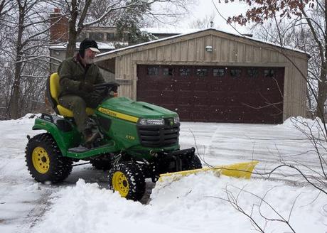 Rick on tractor with snow plow blade attachment