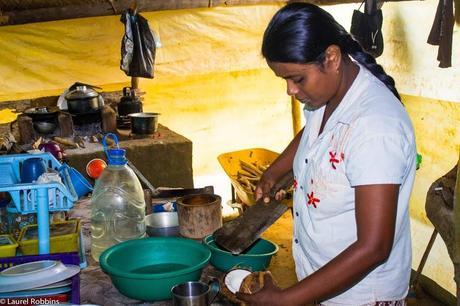 Learning how to make Coconut Sambol from a Sri Lankan farmer's wife as part of an experiential travel program.