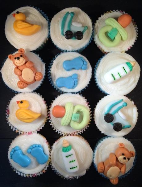 baby showe cupcakes different themed toppers