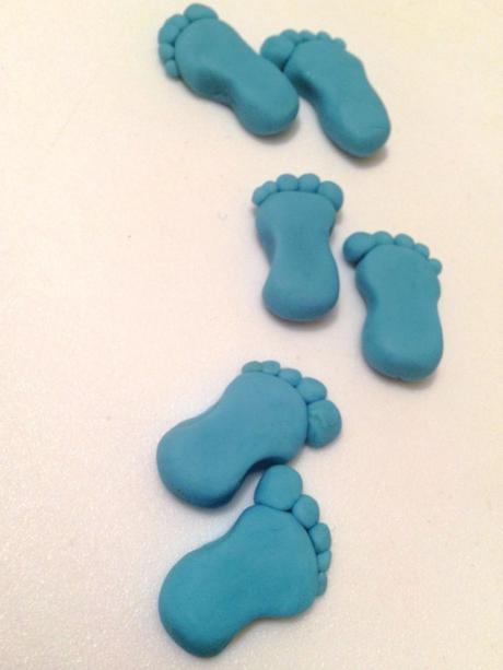 blue footprint pairs made from fondant icing sugarpaste for baby shower cupcakes its a boy baking ideas