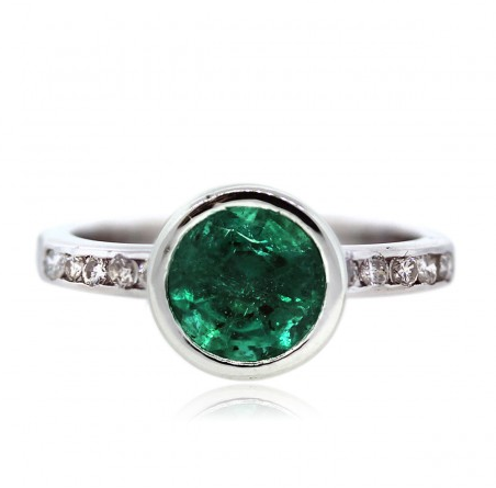 Round bezel set emerald engagement ring