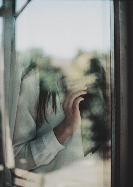 annija-muižule-woman-at-window