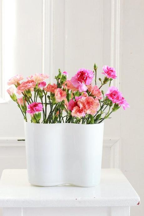 White Alvar Aalto Vase With Pink & Orange Carnations