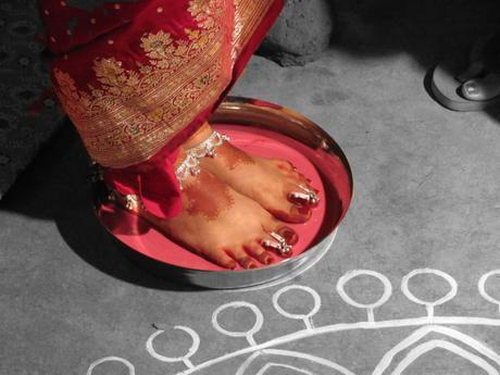 An Indian bride arrives at her marital home. Photo credit: Shounak Ray on Flickr