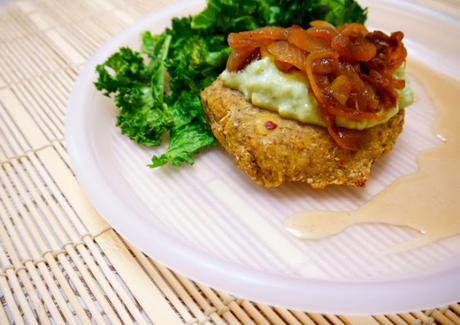 Healthy Homemade Chickpea/ Garbanzo bean Burger with Avocado creamsauce, caramelized onions and baked kale chips