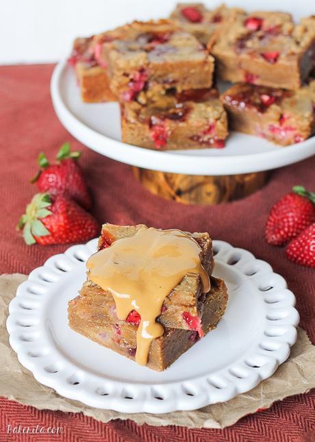 Fresh strawberries and strawberry jelly are swirled into soft peanut butter blondies to create these Peanut Butter & Jelly Bars that taste just like your favorite childhood sandwich! They're super easy and come together in one-bowl.