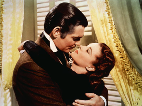 Rhett Butler (Clark Gable) kisses Scarlett O'Hara (Vivien Leigh)