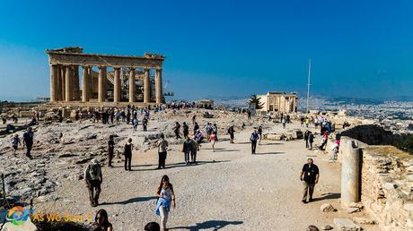 people walking around the open area in the Acropolis