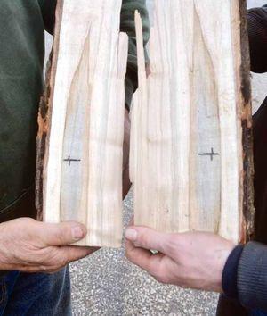 Bob Probst finds cross in cut log