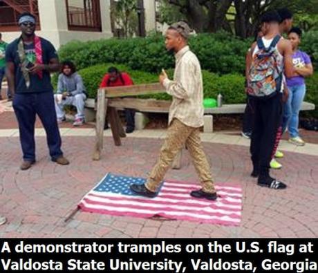 demonstrator trample on U.S. flag in Valdosta State University