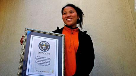 Churrim Sherpa to climb Everest again ~ with bat and jerseys of Phil Hughes