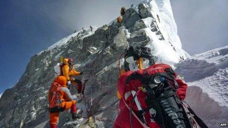 Churrim Sherpa to climb Everest again ~ with bat and jerseys of Phil Hughes