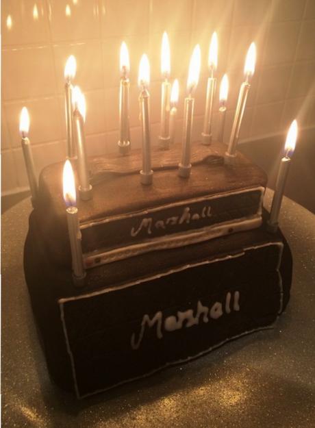 marshall amp stack birthday cake lit with candles