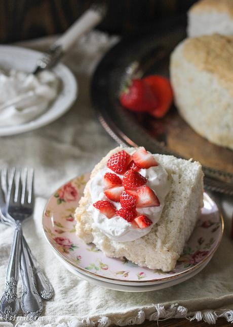 This Vanilla Bean Angel Food Cake is light and airy, with a pure vanilla scent from the vanilla beans flavoring the cake. It's the perfect light dessert when served with berries and whipped cream.