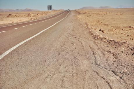 Besides the paved road, there was sand as far as the eye could see. We sometimes saw trucks kicking up dust as they made their way to various mines as northern Chile holds the largest mines in the world.  